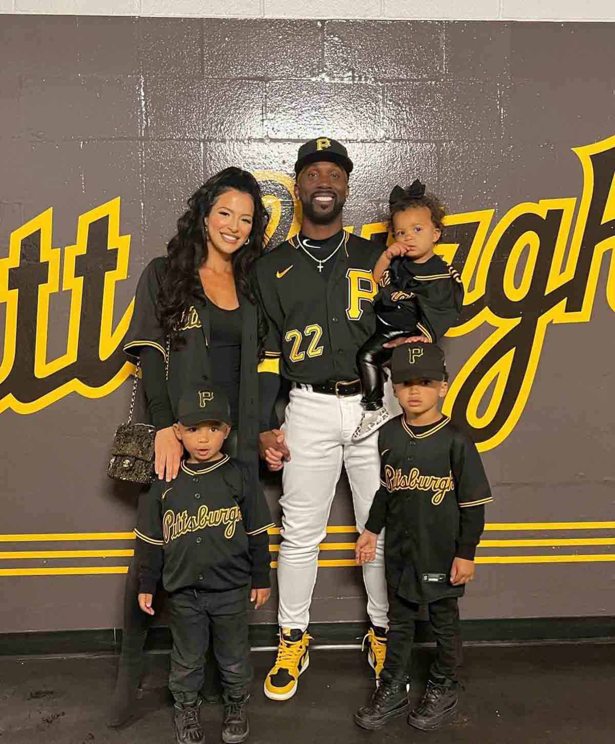 Maria and Andrew McCutchen with their children in uniform.